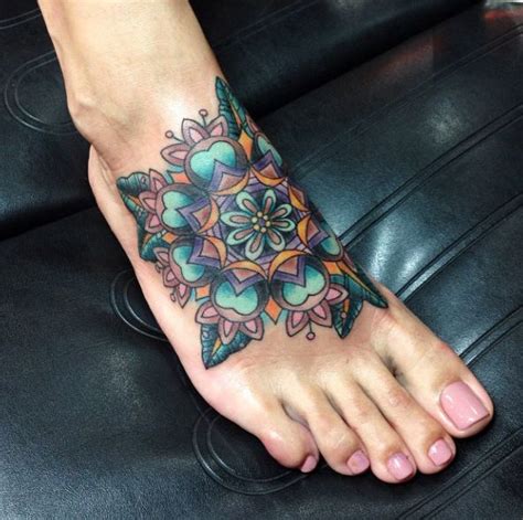 Foot tattoos are becoming increasing popular amongst both males and females. simple foot tattoo #Sleevetattoos | Mandala foot tattoo ...
