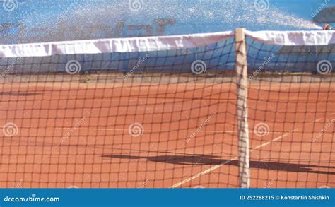 Turkey Antalya A Person Splashes Water On A Tennis Court