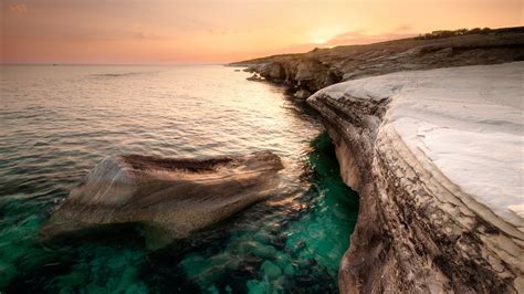 Download 1600x2560 Cyprus Sea Coast Beach Rock Sunset Wallpapers