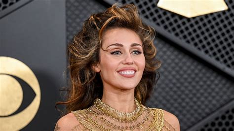Miley Cyrus Stuns In See Through Gold Dress At The 2024 Grammy Awards