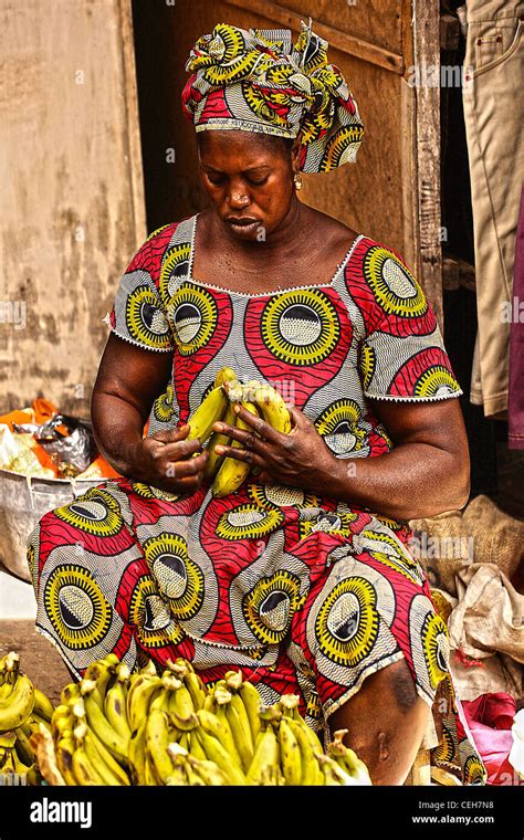 Gambia Woman In Traditional Clothes With Bananas African Market Stock