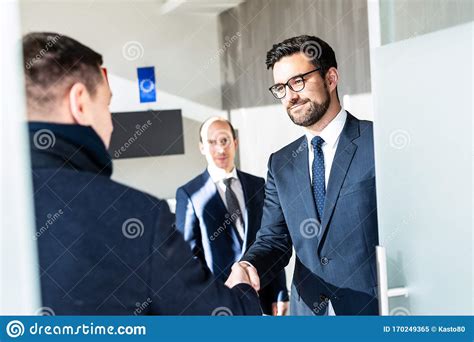 Group Of Confident Business People Greeting With A Handshake At Business Meeting In Modern ...