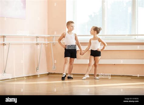 Young Dancers Doing An Exercise While Warming Up At Ballet Class Stock