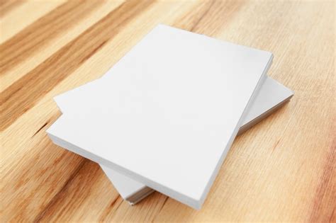 Premium Photo Blank Papers On Wood Table