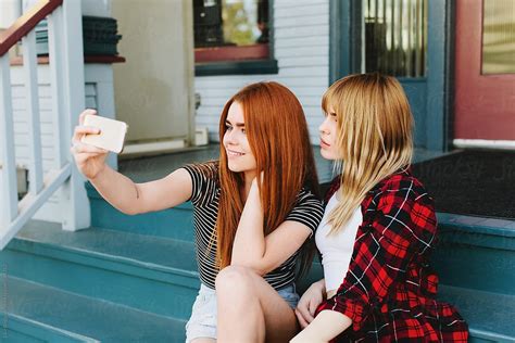 Friends Taking A Selfie By Stocksy Contributor Ellie Baygulov Stocksy