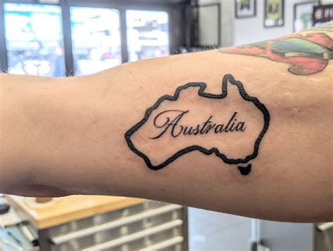 A Person With A Tattoo On Their Arm That Has The Word Australia Written