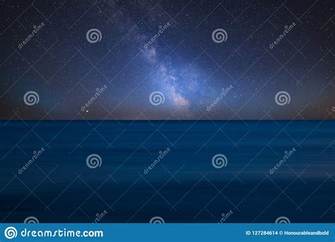 Vibrant Milky Way Composite Image Over Landscape Of Long Exposure Calm