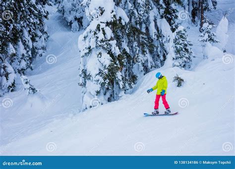 Girl Snowboarder Having Fun In The Winter Ski Resort Stock Photo