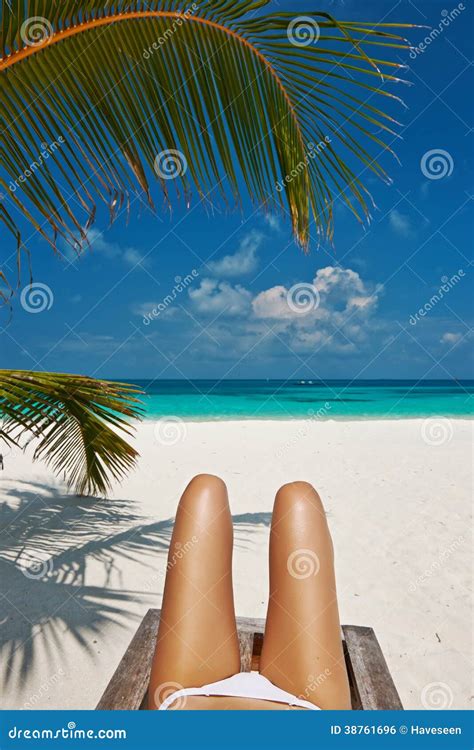 Woman At Beach Lying On Chaise Lounge Stock Photo Image Of Legs Ocean