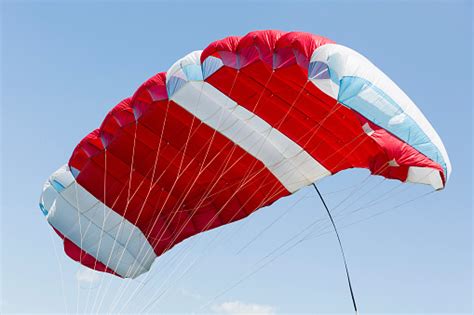 Red Parachute On A Blue Sky Stock Photo Download Image Now