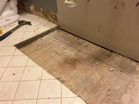 The second floor of this house is built i am replacing the subfloor in a second floor bathroom due to some water damage. subfloor - What is the 2-inch layer of masonry under my bathroom tile? - Home Improvement Stack ...