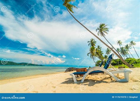 Beautiful Tropical Beach And Sea With Coconut Palm Tree And Chair In