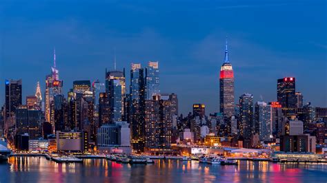 Manhattan City With Lighting Buildings In Blue Sky Background Hd New