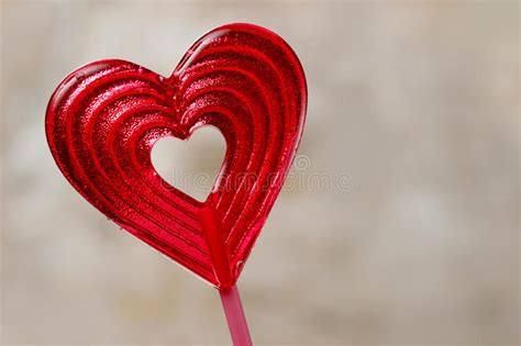Lovely Red Lollipop In Heart Shape Symbol Of Sweet Love Stock Image