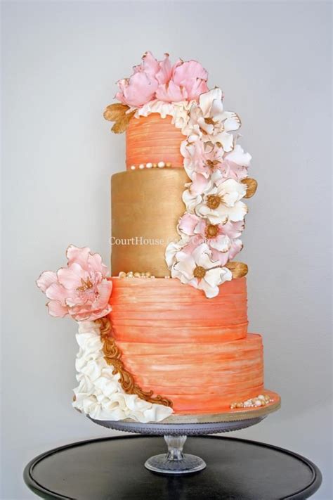 Coral And Gold Wedding Cake With Pink And White Floral Cascade