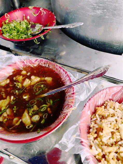 Two Bowls Filled With Food Sitting On Top Of A Table Next To Another