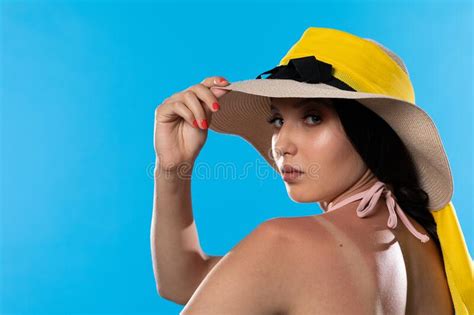 A Teenager In A Big Beach Hat Holds A Hand On A Tanned Shoulder Stock