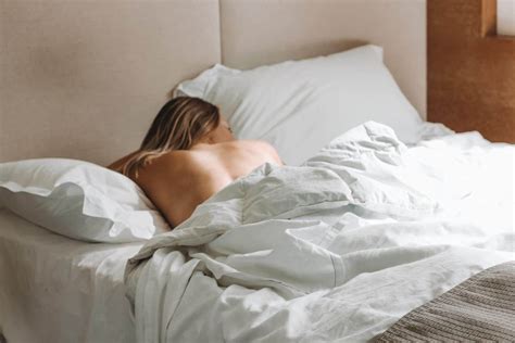 Woman Sleeping In White Comfy Bed