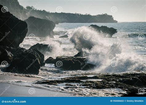 Ocean Waves Crashing Onto The Rocks In The Sunset Stock Photo Image