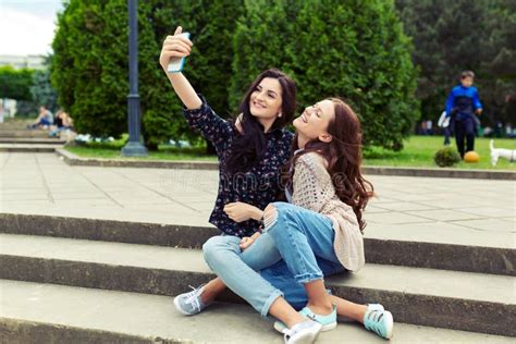 Two Girls Making Funny Selfie On The Street Having Fun Together Stock Image Image Of Sitting
