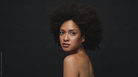 Studio Portrait Of Beautiful Mixed Race Woman With Afro Hairstyle On