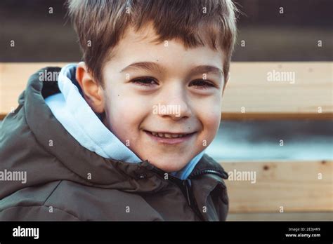 Portrait Of A Cute Little Boy Smiling Timidly Stock Photo Alamy