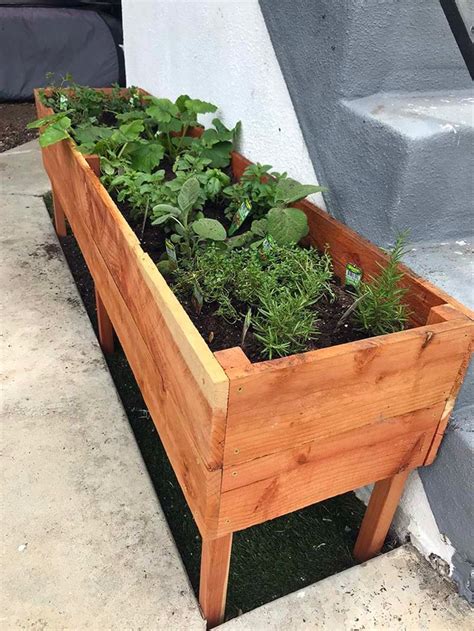 There is a cedar siding wall which is actually the back wall of a residential garage in the background. How to Build a Raised Planter Box | Garden Box | DIY | Diy ...