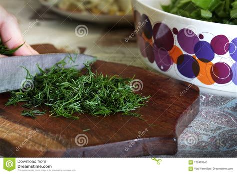 A Cutting Green Parsley On The Cutting Board Stock Photo Image Of