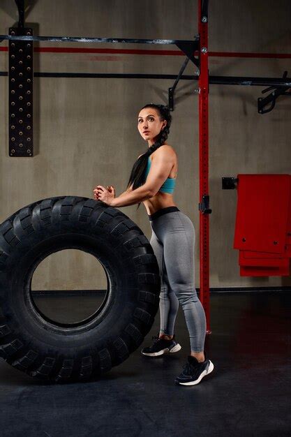 Premium Photo Fit Female Athlete Working Out With A Huge Tire Turning