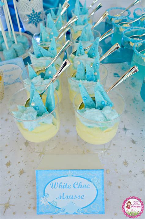 Chocolate cake, homemade chocolate mousse, and chocolate frosting. Frozen themed mini dessert - white chocolate mousse with ...