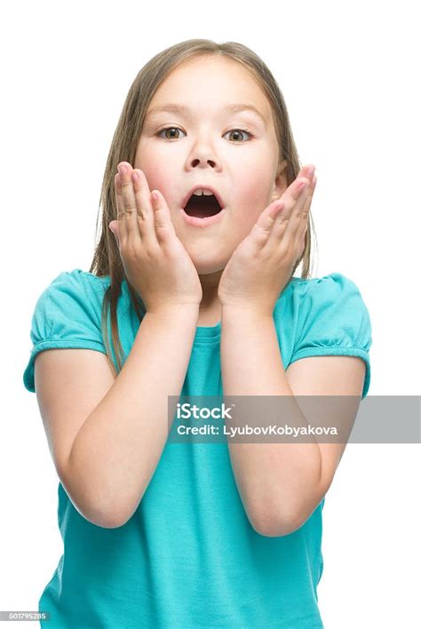 Cute Girl Is Holding Her Face In Astonishment Stock Photo Download