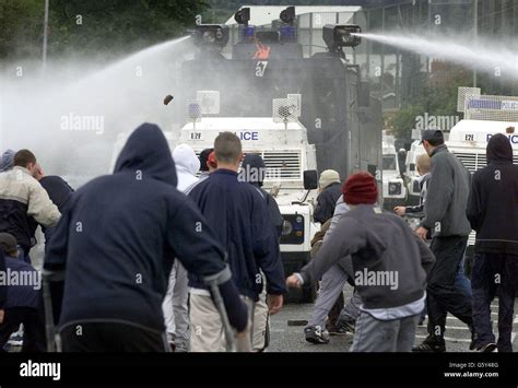 Police Using A Water Cannon To Disperse Nationalists Stock Photo Alamy