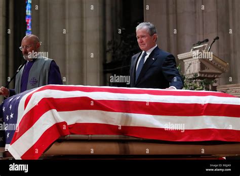 Former President George W Bush Touches The Casket Of His Father Former President George Hw
