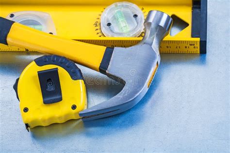 Construction Level Measuring Tape And Claw Hammer Stock Photo Image