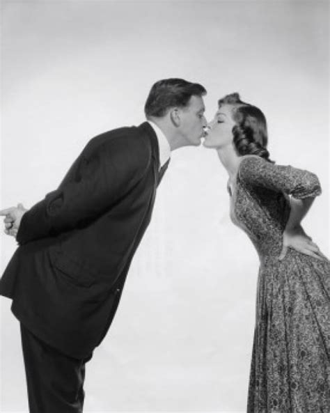 Side Profile Of A Young Couple Kissing Poster Print