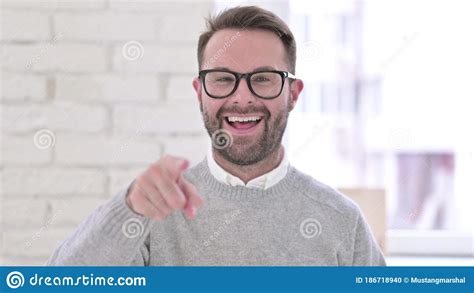 Portrait Of Cheerful Man Pointing At The Camera Stock Photo Image Of