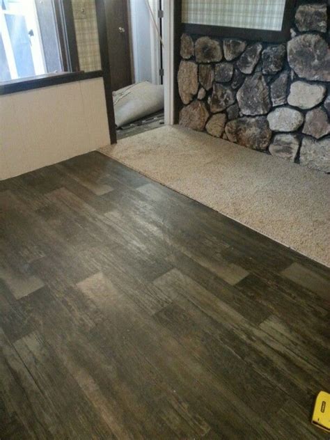 Avoid solid hardwoods in bathroom and kitchen. Barn wood vinyl sheet flooring from Menards | Vinyl sheet ...