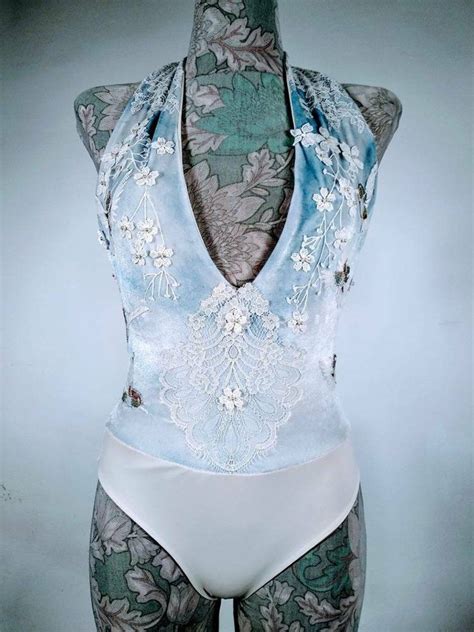 The thick paste is applied to the baby's skin. Alternative Baby Blue Color Bodysuit in straps. White ...