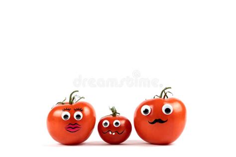 Tomatoes With Funny Faces On A White Background With Copy Space Stock