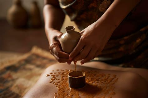 An Ayurvedic Abhyanga Massage In Progress Showing Hands Rhythmically Prepare Herbal Oils To A