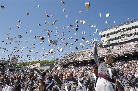 Graduates From The Us Military Academy Toss Their Hats Into The Air