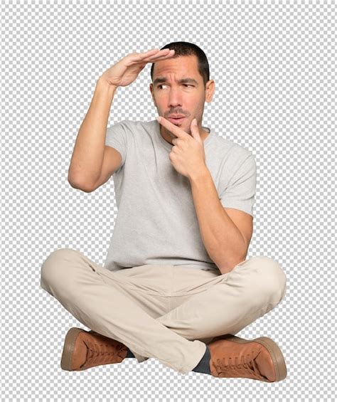 Premium Psd Concentrated Young Man With A Gesture Of Looking Away