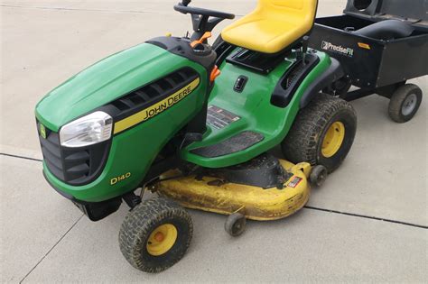 John Deere D140 Lawn Tractor With Tow Behind Baggers And Side Vacuum