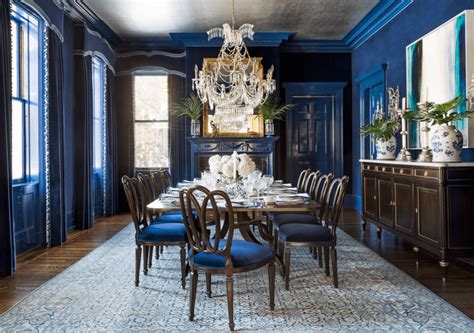 The velvet dining chairs clad in nacy blue clothings and the beautiful chandelier gives off the modern statement that commands orderliness and maximum respect. winfrey-dining-room-veranda-silver-leaf-wallpaper-ceiling ...