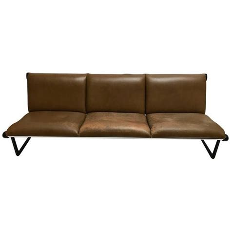 Its metal frame gives an impression of strength, against upholstery in soft tones and tactile textile. Three-Seat Leather Sling Sofa | Chairish