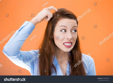 Closeup Portrait Of Young Woman Scratching Head Thinking Daydreaming Deeply About Something