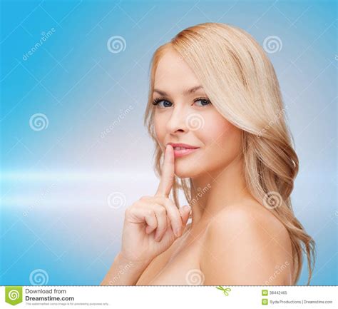 Beautiful Young Woman Pointing Finger To Lips Royalty Free