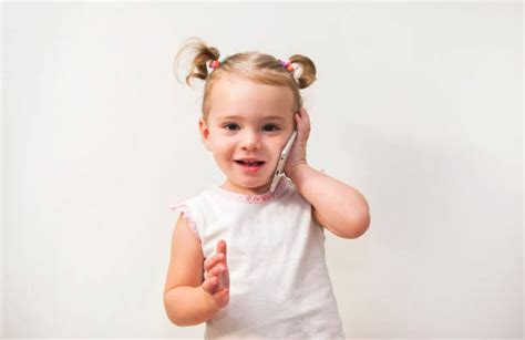 Baby Talking By Cell Phone Stock Photos Pictures And Royalty Free Images