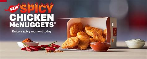 Spicy mcnuggets come in a white box, with orange and green lettering, and small yellow flames on three sides. McDonald's Spicy Chicken McNuggets UK - Price, Review ...