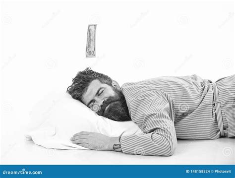 Man With Sleepy Smiling Face Lies On Pillow Sleeps Stock Photo